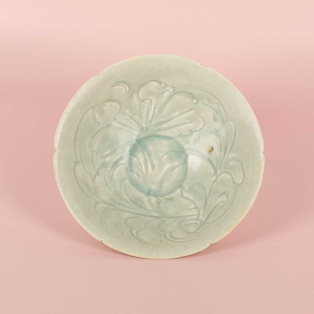 Lot 16 - A Chinese Qingbai 'peony' carved bowl, Southern Song dynasty