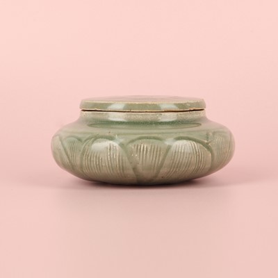Lot 17 - A Chinese Longquan celadon 'floral' jarlet, Song - Ming dynasty