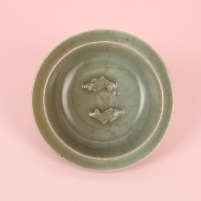Lot 2 - A Chinese Longquan celadon 'twin fish' moulded dish, Song dynasty