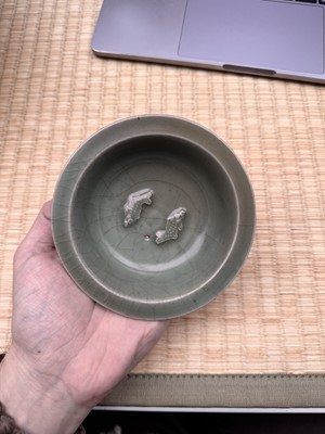 Lot 2 - A Chinese Longquan celadon 'twin fish' moulded dish, Song dynasty