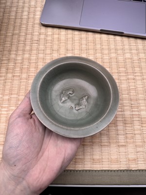 Lot 2 - A Chinese Longquan celadon 'twin fish' moulded dish, Song dynasty