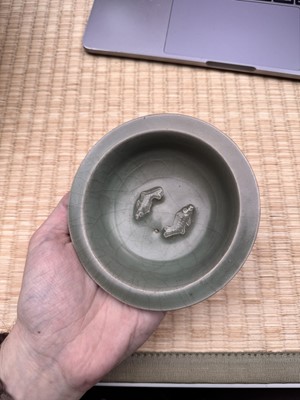 Lot 2 - A Chinese Longquan celadon 'twin fish' moulded dish, Song dynasty