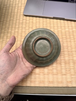 Lot 2 - A Chinese Longquan celadon 'twin fish' moulded dish, Song dynasty