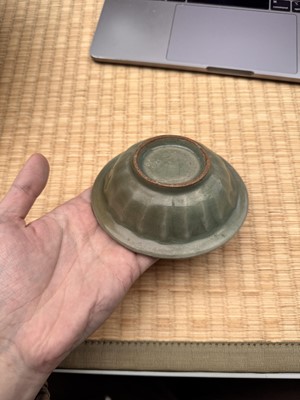 Lot 2 - A Chinese Longquan celadon 'twin fish' moulded dish, Song dynasty