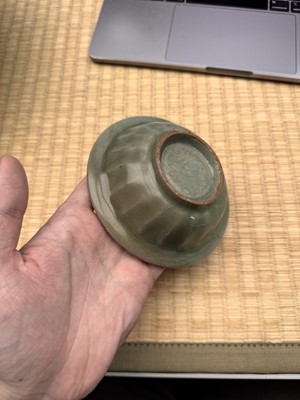 Lot 2 - A Chinese Longquan celadon 'twin fish' moulded dish, Song dynasty