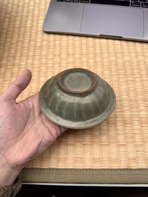 Lot 2 - A Chinese Longquan celadon 'twin fish' moulded dish, Song dynasty