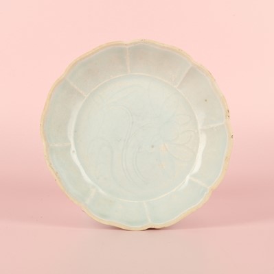 Lot 14 - A Chinese Qingbai 'lotus' carved lobed dish, Southern Song dynasty
