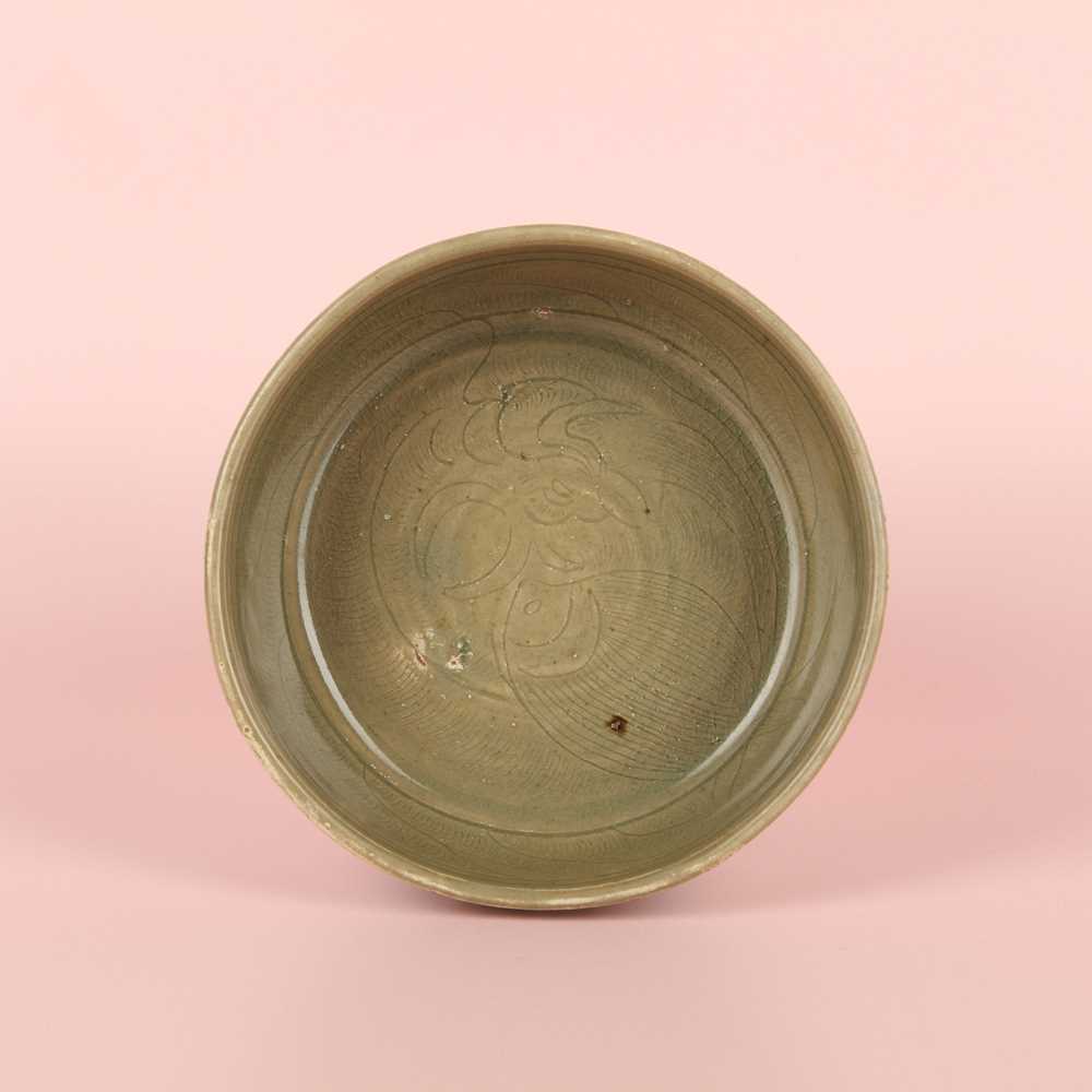 Lot 11 - A Chinese Yue celadon 'lotus' washer, Song dynasty