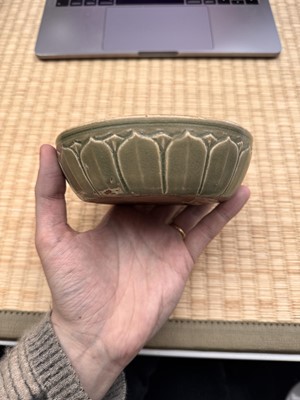 Lot 11 - A Chinese Yue celadon 'lotus' washer, Song dynasty
