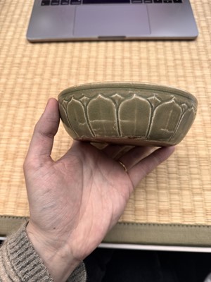 Lot 11 - A Chinese Yue celadon 'lotus' washer, Song dynasty
