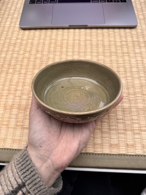 Lot 11 - A Chinese Yue celadon 'lotus' washer, Song dynasty