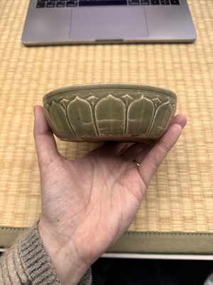 Lot 11 - A Chinese Yue celadon 'lotus' washer, Song dynasty