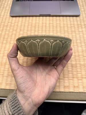 Lot 11 - A Chinese Yue celadon 'lotus' washer, Song dynasty