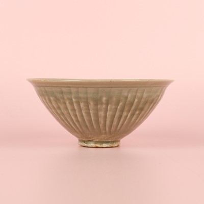 Lot 32 - A Chinese Yaozhou celadon 'chrysanthemum' moulded bowl, Northern Song dynasty