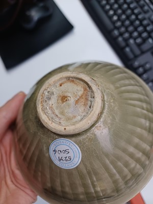 Lot 32 - A Chinese Yaozhou celadon 'chrysanthemum' moulded bowl, Northern Song dynasty