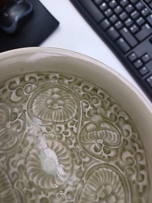 Lot 32 - A Chinese Yaozhou celadon 'chrysanthemum' moulded bowl, Northern Song dynasty