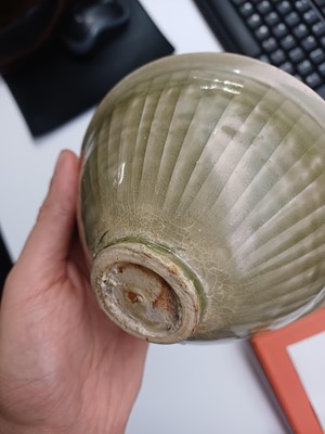 Lot 32 - A Chinese Yaozhou celadon 'chrysanthemum' moulded bowl, Northern Song dynasty