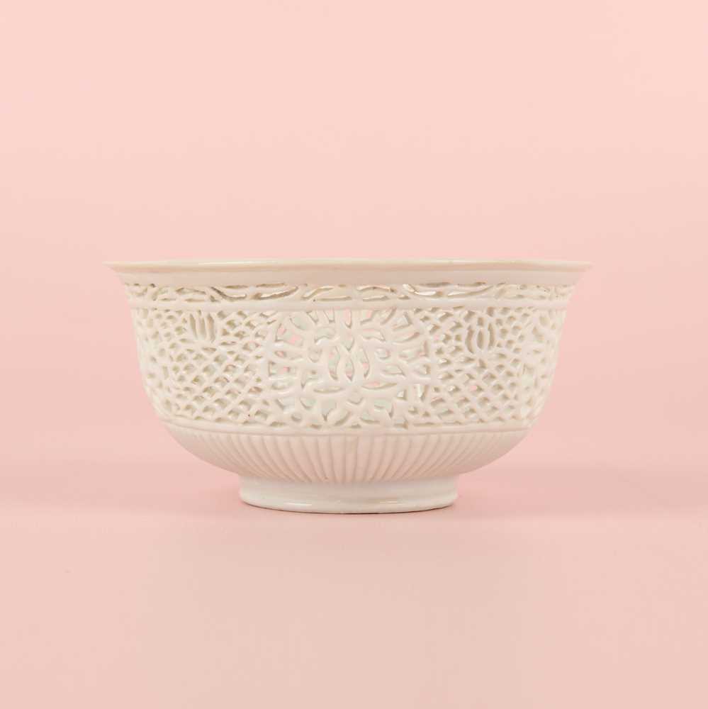Lot 27 - A fine Chinese white-glazed 'linglong' reticulated bowl, Ming dynasty, Chongzhen period