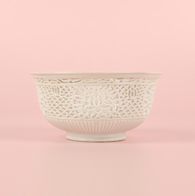 Lot 27 - A fine Chinese white-glazed 'linglong' reticulated bowl, Ming dynasty, Chongzhen period