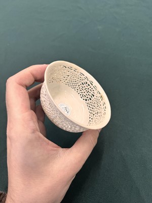 Lot 27 - A fine Chinese white-glazed 'linglong' reticulated bowl, Ming dynasty, Chongzhen period