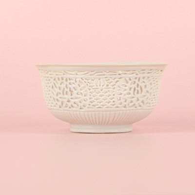 Lot 27 - A fine Chinese white-glazed 'linglong' reticulated bowl, Ming dynasty, Chongzhen period