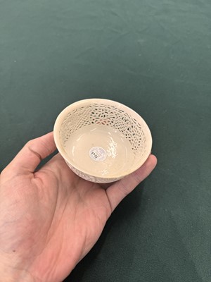 Lot 27 - A fine Chinese white-glazed 'linglong' reticulated bowl, Ming dynasty, Chongzhen period