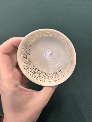 Lot 27 - A fine Chinese white-glazed 'linglong' reticulated bowl, Ming dynasty, Chongzhen period