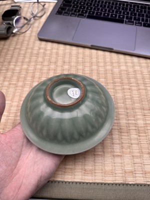 Lot 26 - A Chinese Longquan celadon 'twin fish' moulded dish, Song dynasty