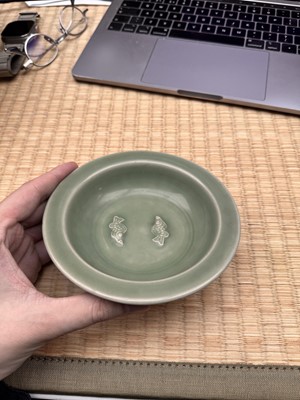 Lot 26 - A Chinese Longquan celadon 'twin fish' moulded dish, Song dynasty