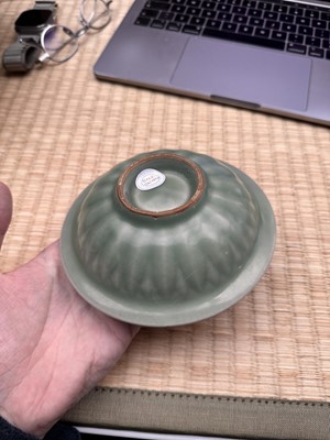 Lot 26 - A Chinese Longquan celadon 'twin fish' moulded dish, Song dynasty