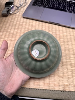 Lot 26 - A Chinese Longquan celadon 'twin fish' moulded dish, Song dynasty