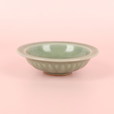 Lot 26 - A Chinese Longquan celadon 'twin fish' moulded dish, Song dynasty