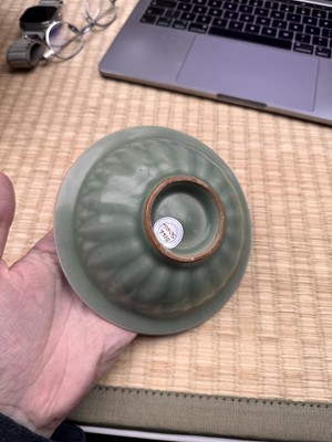 Lot 26 - A Chinese Longquan celadon 'twin fish' moulded dish, Song dynasty