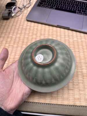 Lot 26 - A Chinese Longquan celadon 'twin fish' moulded dish, Song dynasty