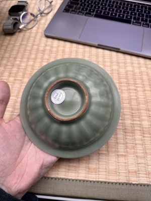Lot 26 - A Chinese Longquan celadon 'twin fish' moulded dish, Song dynasty