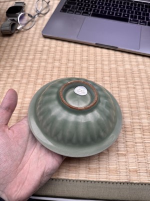 Lot 26 - A Chinese Longquan celadon 'twin fish' moulded dish, Song dynasty