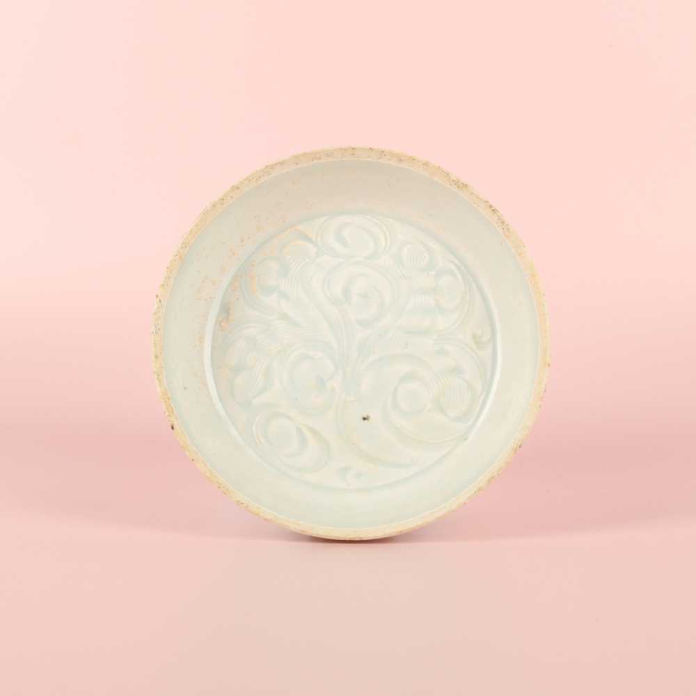 Lot 12 - A Chinese Qingbai 'lotus' carved dish, Southern Song dynasty