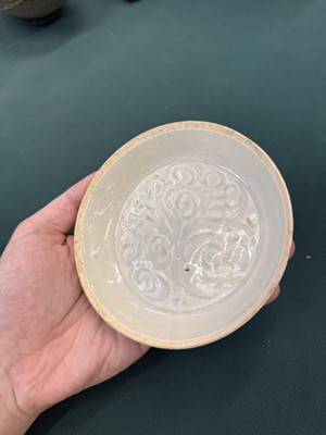 Lot 12 - A Chinese Qingbai 'lotus' carved dish, Southern Song dynasty