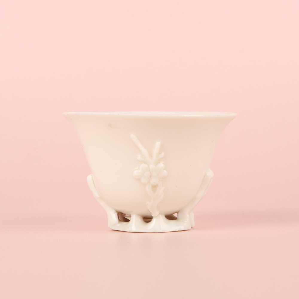 Lot 6 - A Chinese Dehua 'prunus' libation cup, Qing dynasty