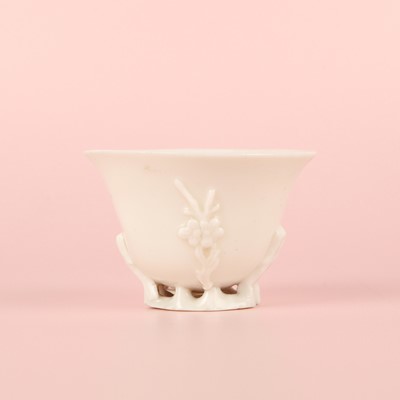 Lot 6 - A Chinese Dehua 'prunus' libation cup, Qing dynasty
