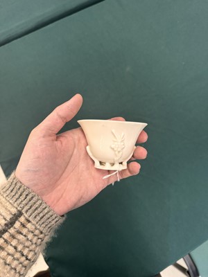 Lot 6 - A Chinese Dehua 'prunus' libation cup, Qing dynasty