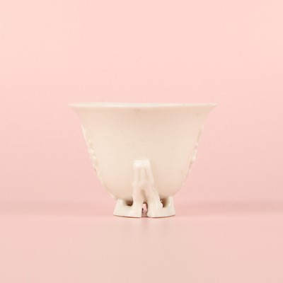 Lot 6 - A Chinese Dehua 'prunus' libation cup, Qing dynasty