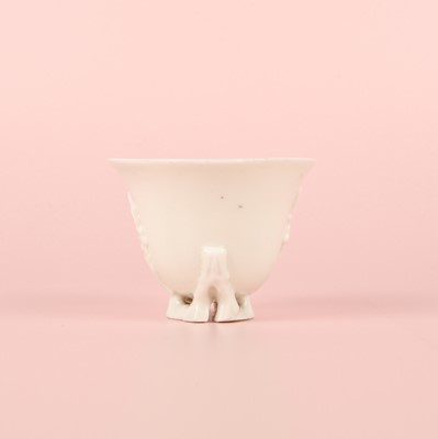 Lot 6 - A Chinese Dehua 'prunus' libation cup, Qing dynasty