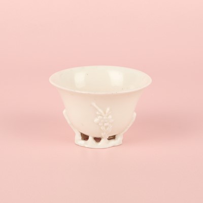 Lot 6 - A Chinese Dehua 'prunus' libation cup, Qing dynasty