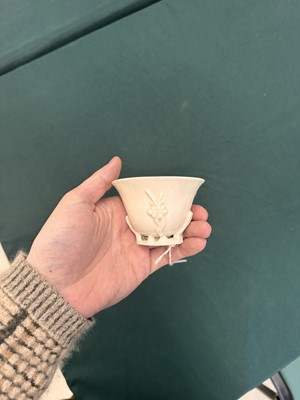 Lot 6 - A Chinese Dehua 'prunus' libation cup, Qing dynasty