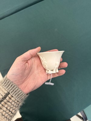 Lot 6 - A Chinese Dehua 'prunus' libation cup, Qing dynasty