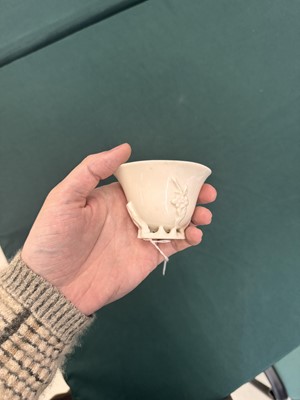 Lot 6 - A Chinese Dehua 'prunus' libation cup, Qing dynasty