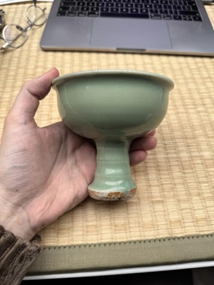 Lot 28 - A Chinese Longquan celadon stem cup / bowl, Yuan - Early Ming dynasty