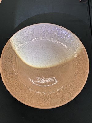 Lot 485 - A large Chinese Longquan celadon 'peony' charger, Ming Dynasty