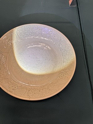Lot 485 - A large Chinese Longquan celadon 'peony' charger, Ming Dynasty